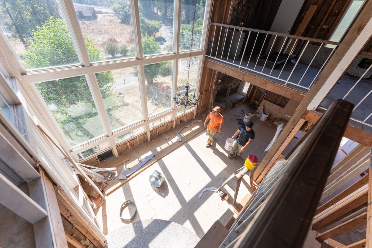 Aerial view of crew working inside a double-height construction space